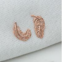 rose gold feather stud earrings mismatched