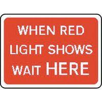 SIGN WHEN RED LIGHT SHOWS WAIT HERE 1050X750 ALUMINIUM