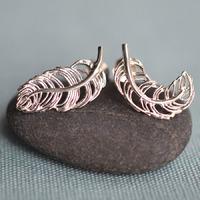 silver feather stud earrings mismatched
