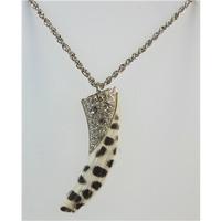 Silver tone chain necklace with faux animal tooth pendant