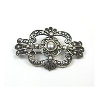 Silver tone round & loop brooch