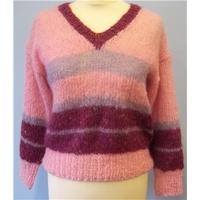 small pink looseknit jumper