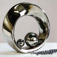 spin sculpture in ceramic silver glazed with silver balls