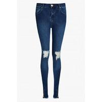 STELLA RIPPED REGULAR RISE SKINNY JEANS