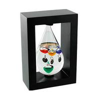 teardrop galileo thermometer in wooden frame glass