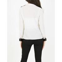 trish white and black blouse with central zip
