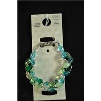 Turquoise glass bracelet. M&S Marks & Spencer - Size: Medium - Blue