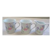 Two teacups and milk jug