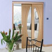 twin telescopic pocket salerno oak veneer door clear glass