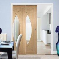 twin telescopic pocket pesaro oak veneer door clear glass