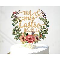 wedding cake topper printed with floral wreath and personalized with l ...