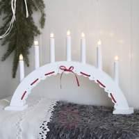 white and red candle arch vira 7 lights