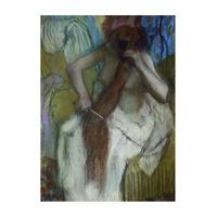 woman combing her hair by edgar degas