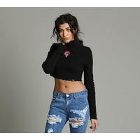 womens tongue badge frill polo crop top